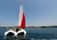 sailing toward land multihull yacht